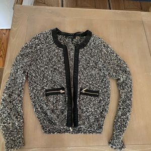 Zip up tweed sweater with leather detail. M.